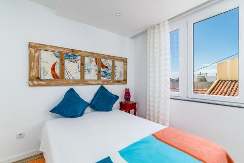 T2 Tiles Apartment Estoril客房内的一张或多张床位