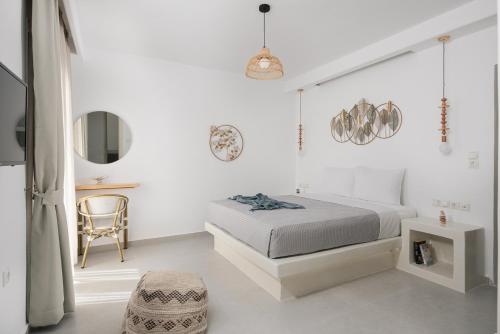 Naxos Skyline Deluxe Villas客房内的一张或多张床位