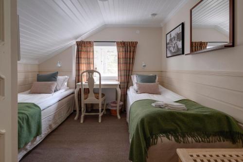 欧拉斯戈登酒店客房内的一张或多张床位