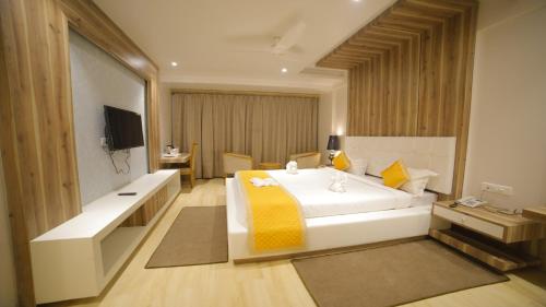Dhamma Grand Hotel Resort客房内的一张或多张床位