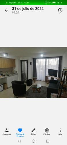 兰卡瓜Departamento Nuevo Premium Hospedaje Rancagua - Centro的客厅配有沙发和桌子