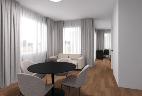 格伦兴MOOI Apartments Grenchen的客厅配有桌椅和沙发