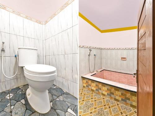 吉利马努克OYO 91192 Homestay Antara的一间带卫生间和浴缸的浴室