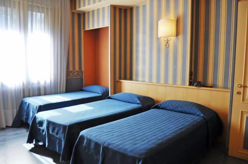 伽达酒店客房内的一张或多张床位