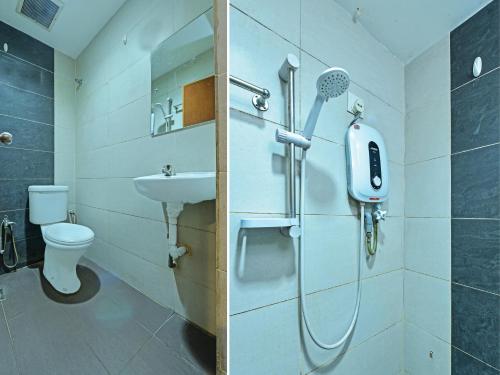 新山OYO 90510 Hotel Sahara的带淋浴、卫生间和盥洗盆的浴室