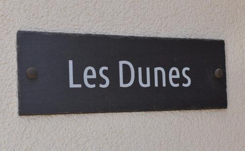 坎伯利Les Dunes的墙上少跳舞的标语