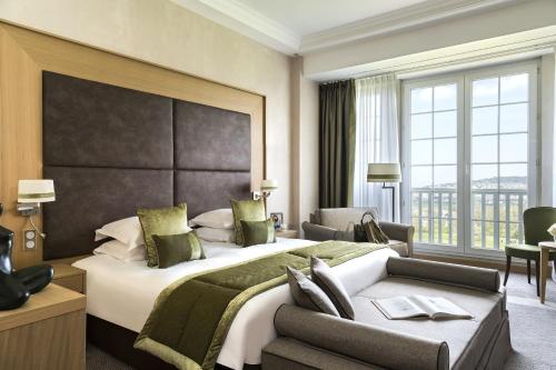 高尔夫巴里亚酒店客房内的一张或多张床位