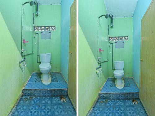 哥打巴鲁OYO 90454 Haza Harmoni Guesthouse的一间位于摊位的卫生间浴室
