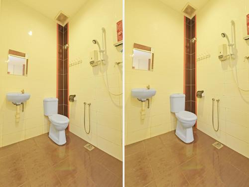 马六甲OYO 582 Hotel Walk Inn的浴室设有2个卫生间和水槽