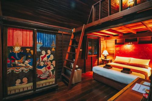 卡农里罗天堂酒店的一间卧室配有一张双层床和梯子