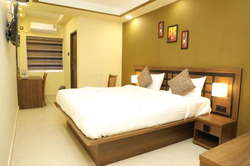 KANS ONE - Madipakkam客房内的一张或多张床位