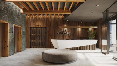 科帕奥尼克Aparthotel Woodside by Anaya的办公室大堂设有白色的办公桌和圆凳