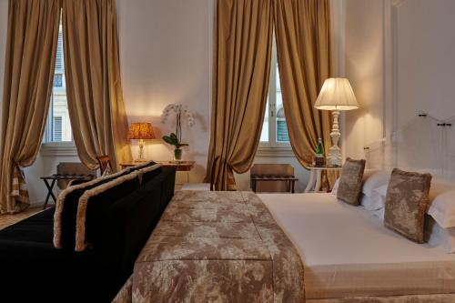 Casa Howard Firenze - Residenza d'Epoca客房内的一张或多张床位