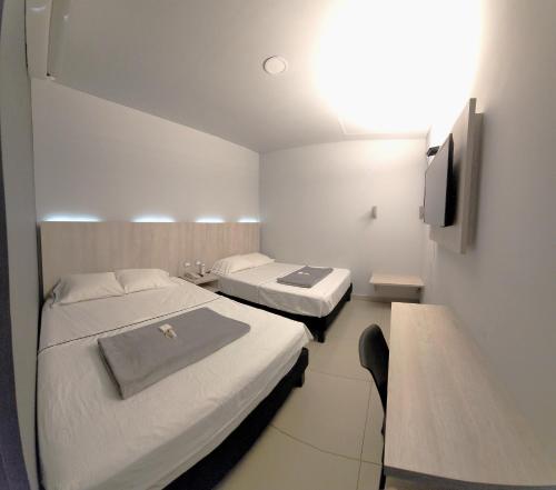 HOTEL NABU DEL PACIFICO客房内的一张或多张床位