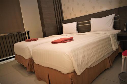 Nutana Hotel Lombok客房内的一张或多张床位
