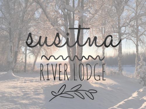 塔尔基特纳Susitna River Lodging, Backwoods Cabins的雪中奥斯特拉利亚河的标志