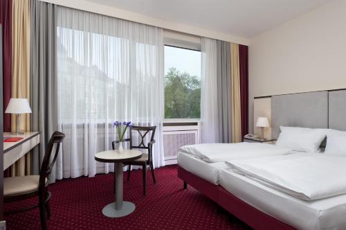 柏林选帝侯大街卡姆酒店客房内的一张或多张床位