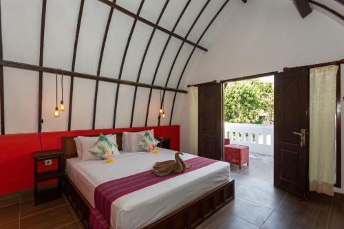 吉利特拉旺安Kidi's Lodge Gilitrawangan的卧室配有一张床