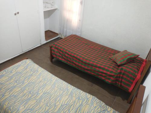 Plumerillo Park客房内的一张或多张床位