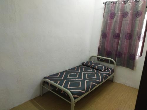 Homesstay De' Restu客房内的一张或多张床位