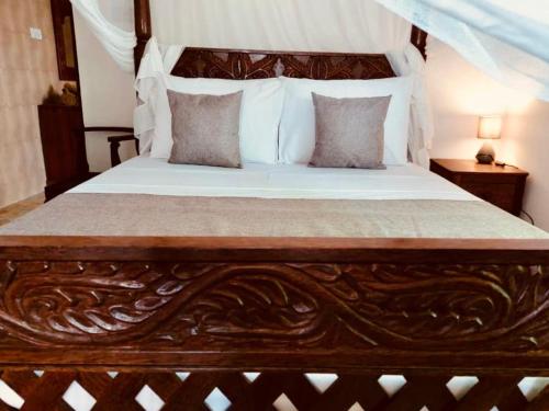 Helwas Zanzibar Beach Hotel客房内的一张或多张床位