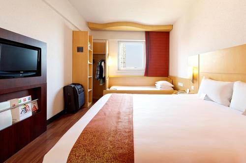 宜必思北京东大桥酒店客房内的一张或多张床位
