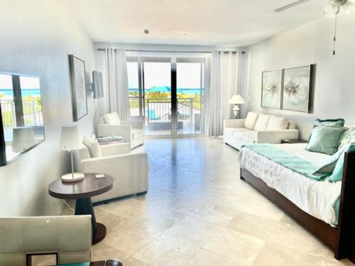 Private Poolside, Loft-Like Condo with Panoramic Grace Bay Views, Walk to Beach, Restaurants, & Turtle Cove Marina!