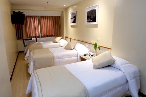 门戈宫酒店客房内的一张或多张床位