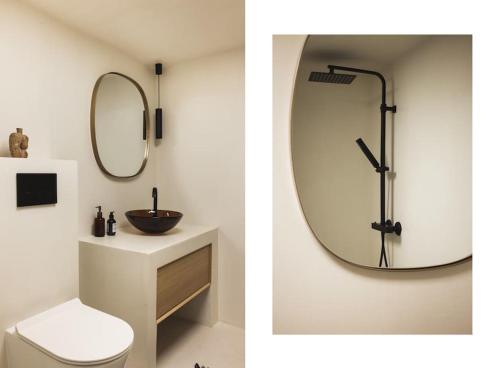 BømloCozy villa in Bømlo的浴室设有镜子、卫生间和水槽