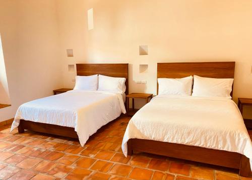 Casa Santo Domingo Guadalupe Santander客房内的一张或多张床位