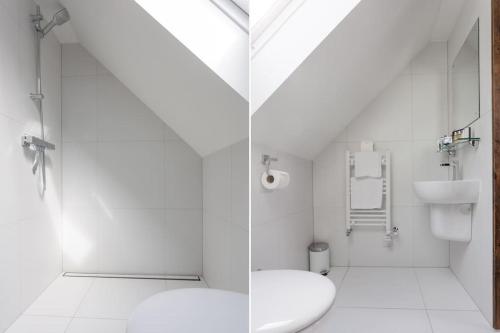 凯里肯Isle of Skye Cottage的白色的浴室设有卫生间和水槽。
