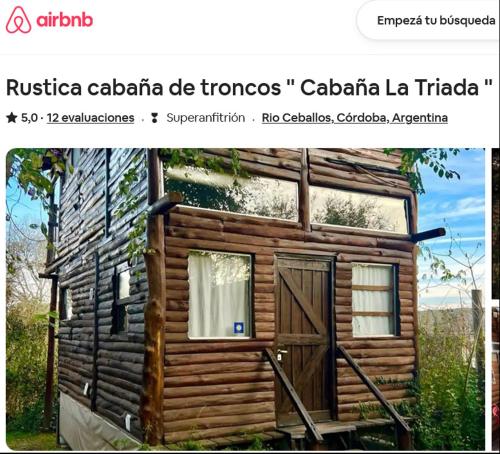 里奥塞瓦约斯Cabaña La Triada, Grupo Cabaña La Triada的一张带门的小木屋的照片