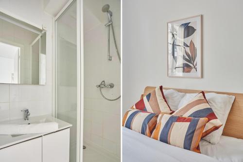 塞纳河畔讷伊Residence Neuilly Bois de Boulogne by Studio prestige的一间带水槽和淋浴的浴室
