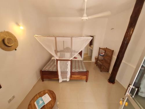 Ladha ya Zanzibar Boutique Guesthouse客房内的一张或多张床位