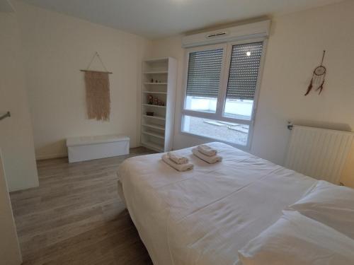 SAINT DENIS appartement 2 chambres avec parking客房内的一张或多张床位