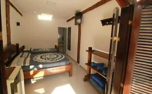 博西坎加Toca do Capitao的卧室配有一张床