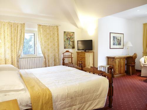 米兰SNC酒店客房内的一张或多张床位