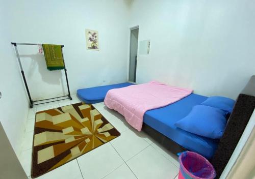 SOFIZZ Muslim Homestay客房内的一张或多张床位