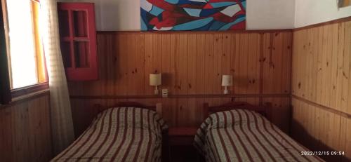 Hostel San Gregorio客房内的一张或多张床位