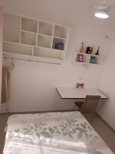 Apartamento Itaguá 9客房内的一张或多张床位