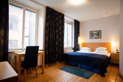 赫尔斯登酒店集团客房内的一张或多张床位