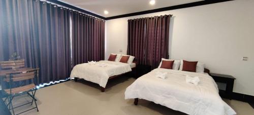 Paradise Cozy Guesthouse Sihanoukville客房内的一张或多张床位