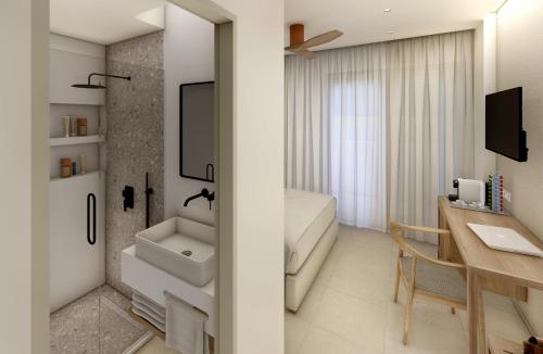 卡尔扎迈纳Agrelli Hotel & Suites的一间带水槽和书桌的浴室
