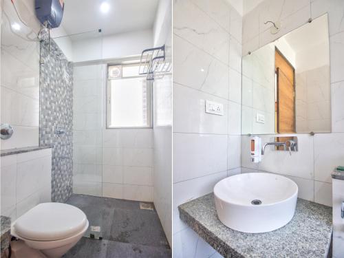 卡兰古特Sea Sapphire的白色的浴室设有卫生间和水槽。
