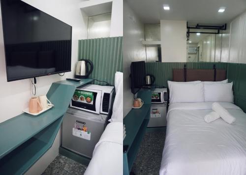 宿务Cebu Backpackers Hostel的客房设有一张床和一台平面电视。