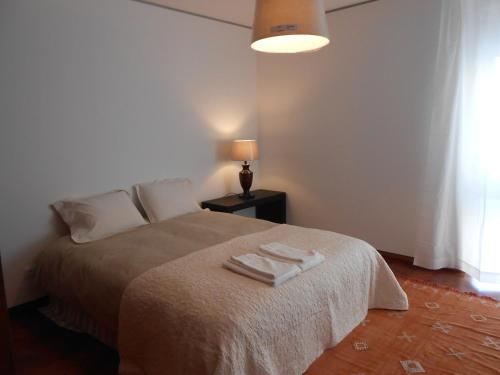 Cacao Estoril Apartment客房内的一张或多张床位