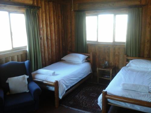 Greenfire Drakensberg Lodge客房内的一张或多张床位