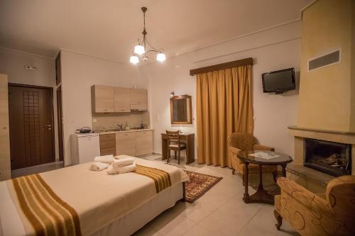 尼奥楚里翁Nefeles的酒店客房带一张床和一个厨房