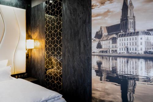 什未林PLAZA Premium Schwerin Sure Hotel Collection by Best Western的河景酒店客房