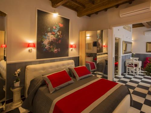 佛罗伦萨Locanda di Mosconi的一间卧室配有一张壁画床